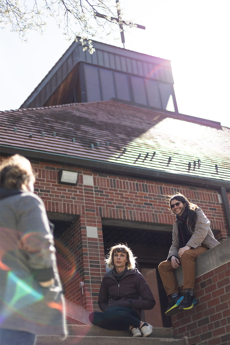 Students gather outside of the building